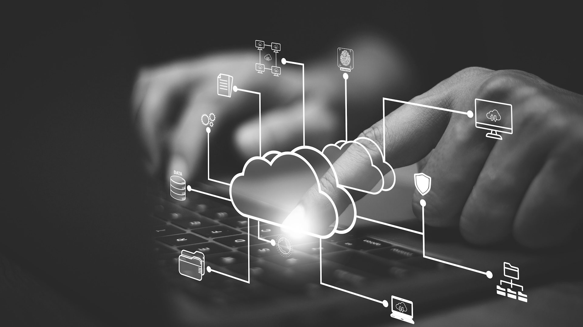Businessman with cloud computing diagram show on hand. Cloud technology. Data storage. Networking and internet service concept. Business professional interacting with cloud computing interface representing data storage, cloud migration, and managed IT services